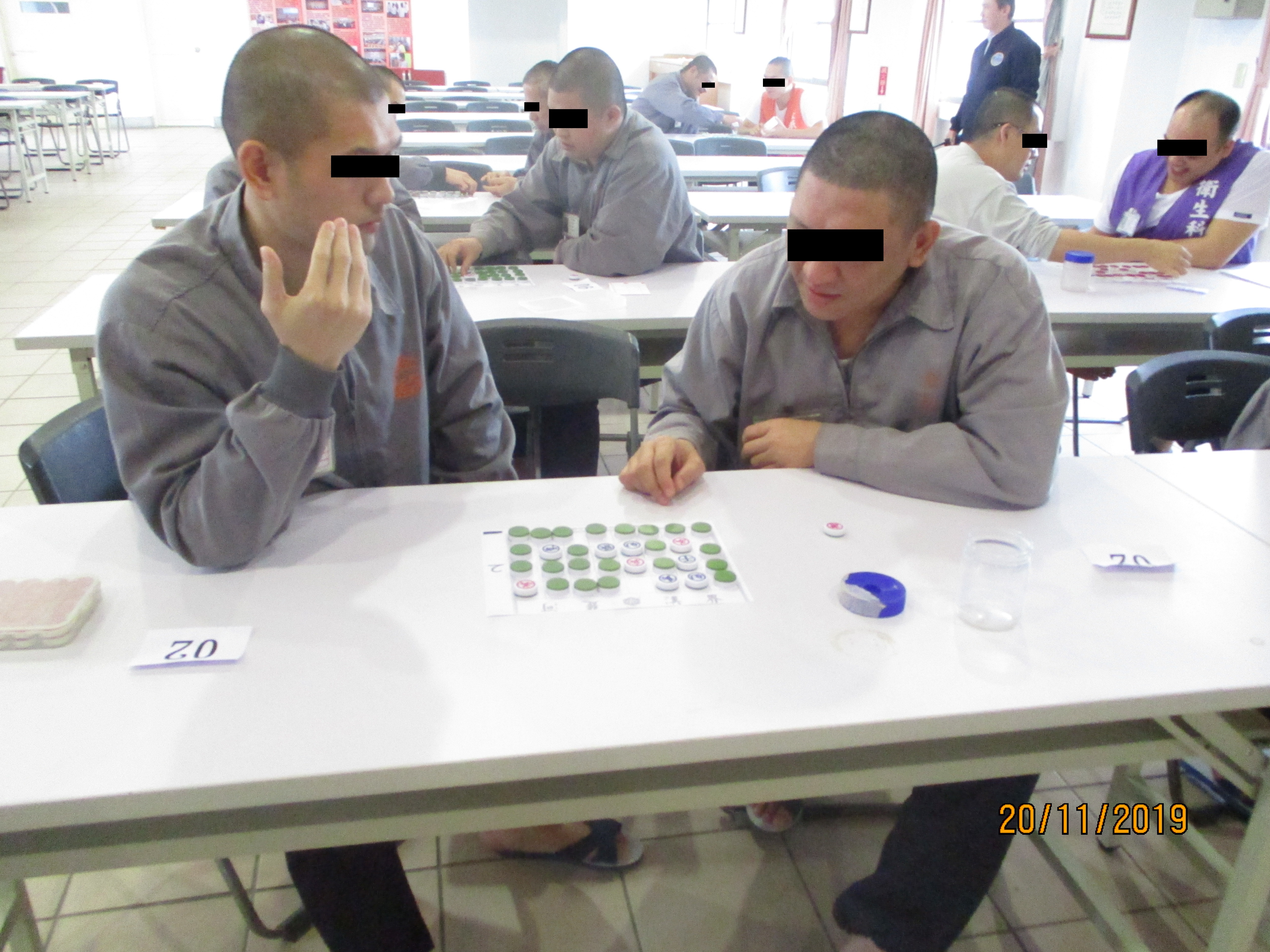 Inmates Focus on Chess Game