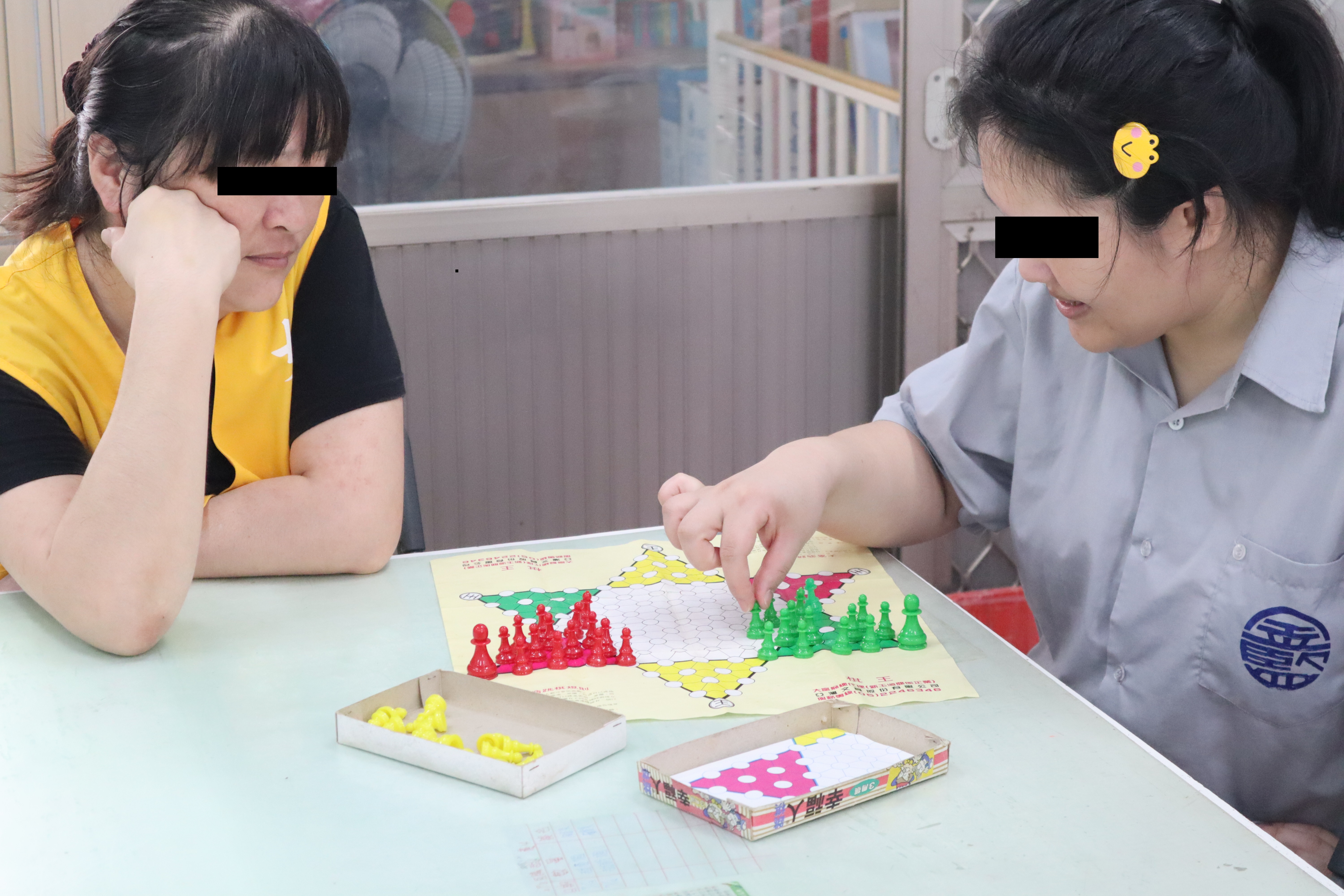 Female Inmates Focus on Playing Chess