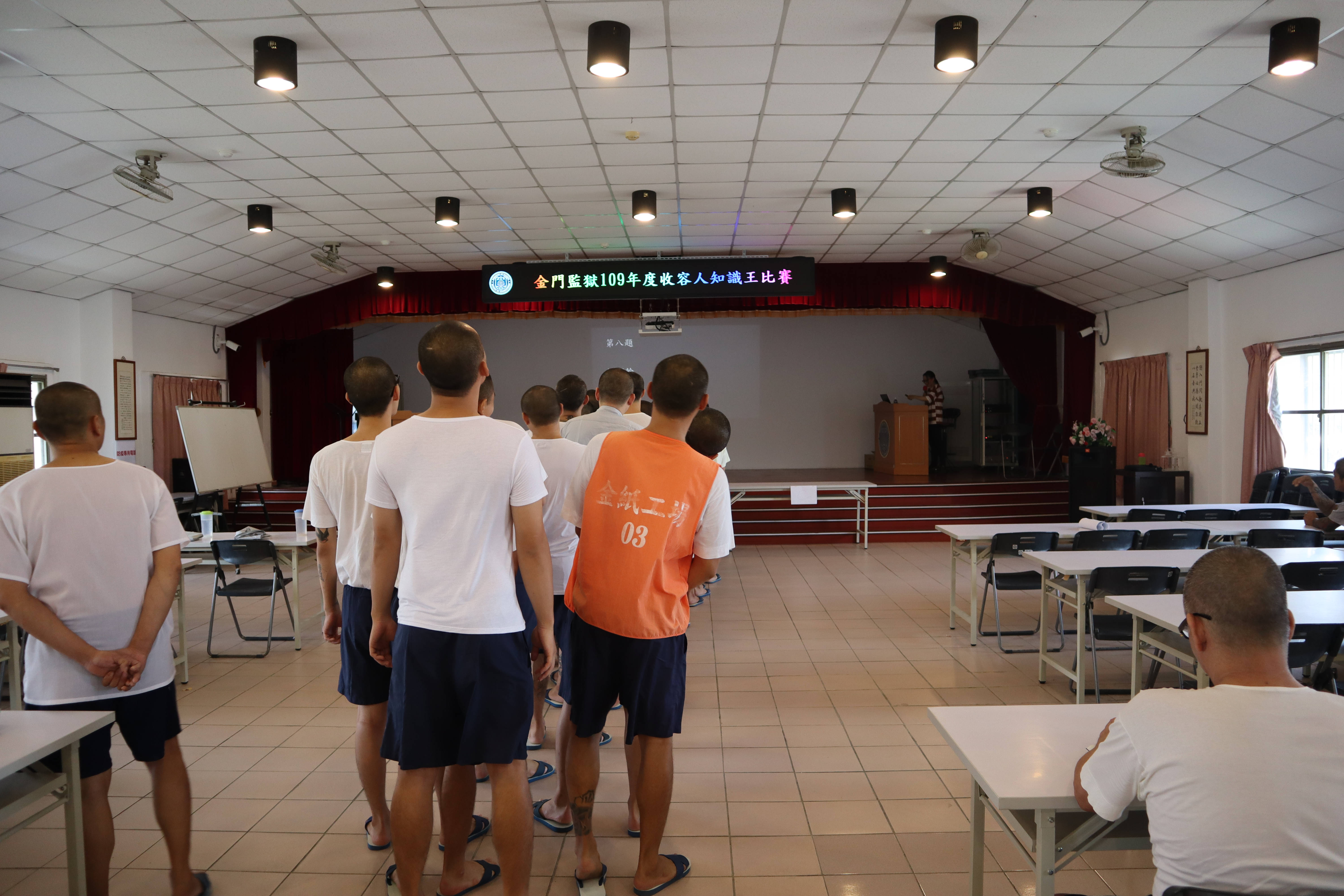 Inmates focus on listening to the topic