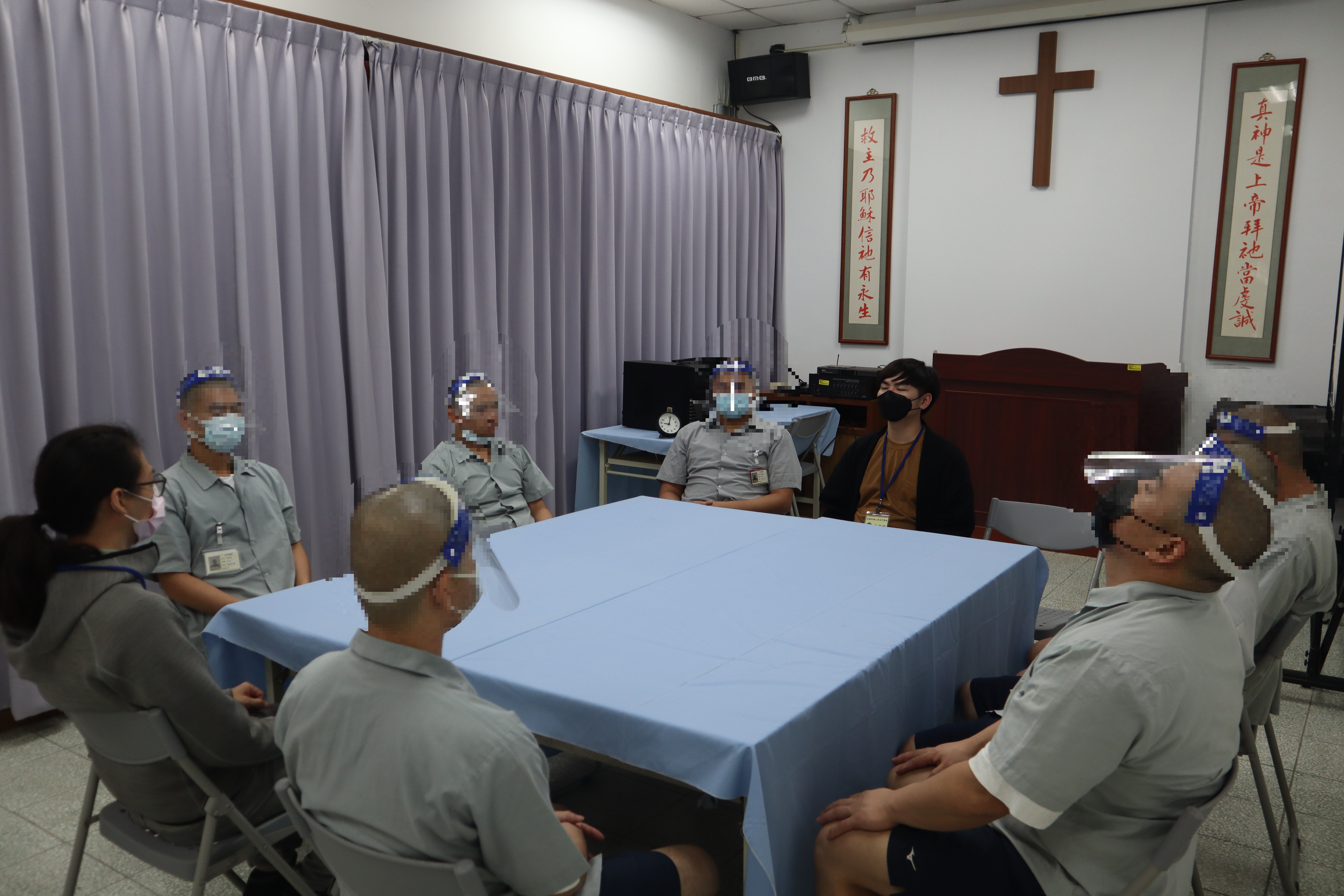 Psychologists practice progressive muscle relaxation exercises with inmates